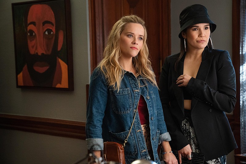 Safety-first: Debbie Dunn (Reese Witherspoon) finds her horizons expanded by her spontaneous new friend Minka (Zoe Chao) in the Netflix film “Your Place or Mine.”