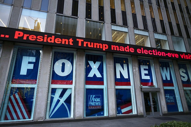 FILE - A headline about President Donald Trump is displayed outside Fox News studios, on Nov. 28, 2018, in New York. (AP Photo/Mark Lennihan, File)