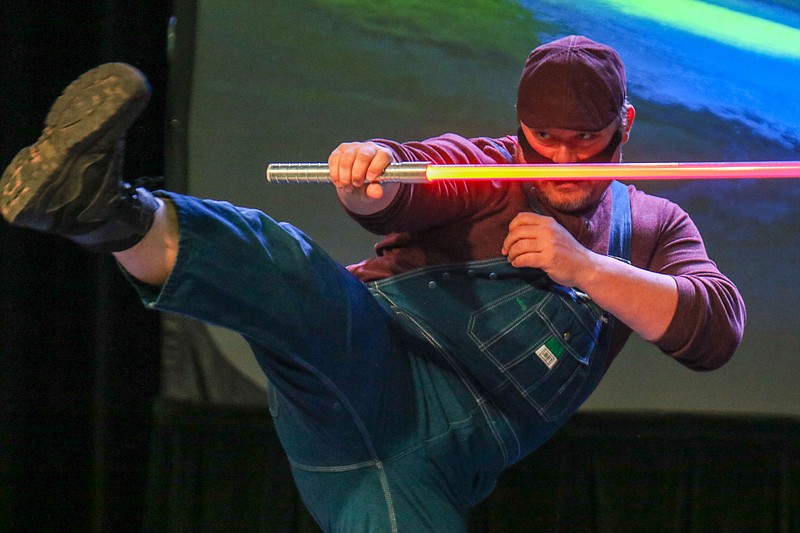 Staff photo by Olivia Ross  / Jared Jordan participates in the lightsaber dance competition at Con Nooga at the Chattanooga Convention Center on Saturday, February 18, 2023. Con Nooga featured artists, cosplay guests, animals, vendors, contests, and more.