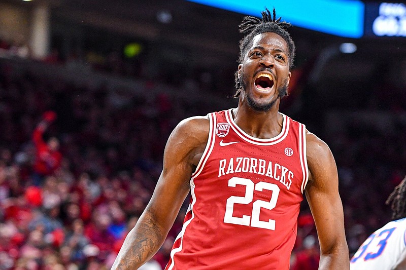 Arkansas forward/center Makhel Mitchell (22) reacts after this dunk, Saturday, Feb. 18, 2023, during the second half of the Razorbacks’ 84-65 win over the Florida Gators at Bud Walton Arena in Fayetteville.