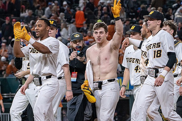 Missouri catcher Dylan Leach (shirtless) waves to the crowd after hitting a game-winning double during a game against Texas on Saturday, Feb. 18, 2023, in Arlington, Texas. (Courtesy Ben Warski, Mizzou Athletics)