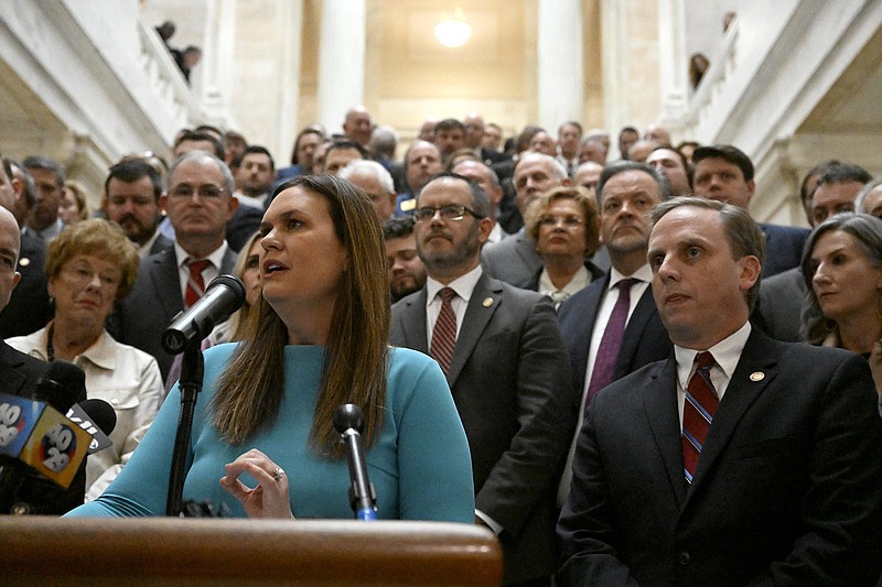 Governor Sarah Huckabee Sanders, surrounded by legislators, students, parents and teachers, announced details of her education plan on the steps outside the House Chambers in the State Capitol on Wednesday, Feb. 8, 2023...(Arkansas Democrat-Gazette/Stephen Swofford)