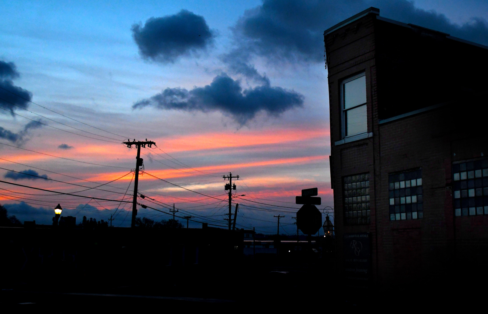 Staff Photo by Robin Rudd / As dawn breaks over Rossville Avenue the dull sheen on a window conjures the poet Dylan Thomas's words, 