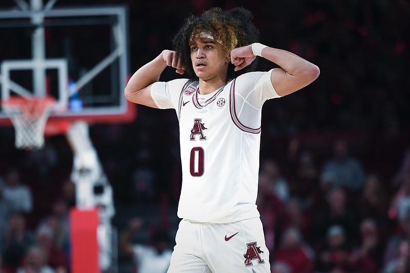 Arkansas guard Anthony Black flexes during a game against Georgia on Tuesday, Feb. 21, 2023, in Fayetteville.