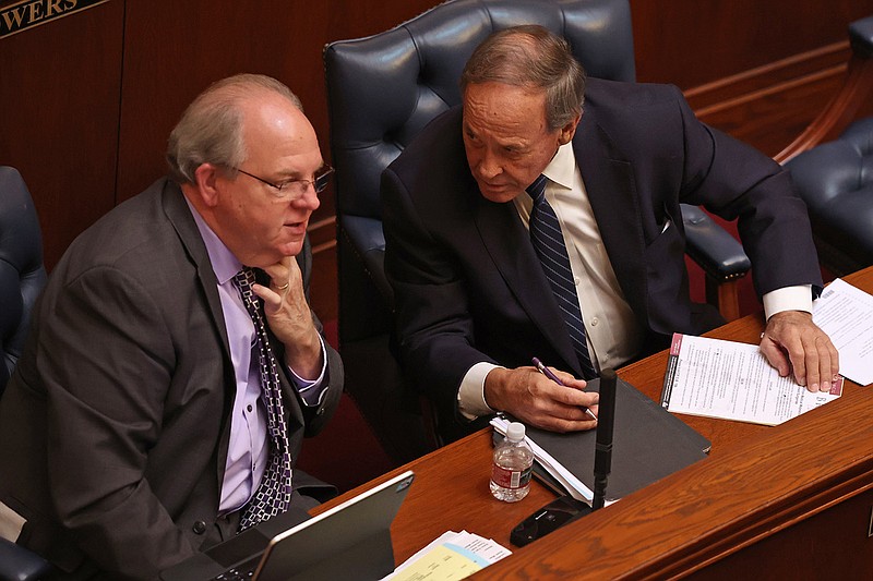 Sen. Gary Stubblefield, R-Branch at right, confers with Sen. Terry Rice, R-Waldron, on the Senate floor at the state Capitol on Tuesday, Feb. 21, 2023. (Arkansas Democrat-Gazette/Colin Murphey)