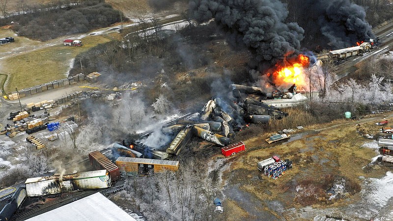 FILE - In this photo taken with a drone, portions of a Norfolk Southern freight train that derailed the previous night in East Palestine, Ohio, remain on fire at mid-day on Feb. 4, 2023. (AP/Gene J. Puskar, File)