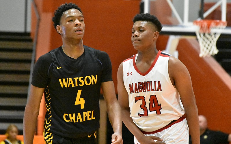 Jai'Kori Phillips of Watson Chapel and Roderick Williams Jr. of Magnolia walk to the near end of the court during the 4A South Region final in Warren on Saturday, Feb. 25, 2023. (Pine Bluff Commercial/I.C. Murrell)