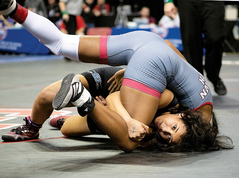 Jacinda Espinosa of Capital City pulls down Zayla Vann of Raytown South during their quarterfinal match at 140 pounds Friday in the Class 2 girls wrestling state championships at Mizzou Arena in Columbia. (Kate Cassady/News Tribune)