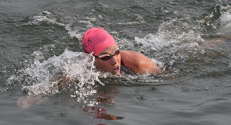 Staff Photo by Matt Hamilton / Jackie Hering completes the swimming portion of the 2022 Sundbelt Bakery Ironman along Riverfront Parkway in Chattanooga on Sunday, May 22, 2022.