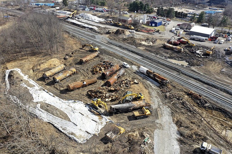 FILE - A view of the scene Friday, Feb. 24, 2023, as the cleanup continues at the site of a Norfolk Southern freight train derailment that happened on Feb. 3, in East Palestine, Ohio. On Tuesday, Feb. 28, in the wake of a fiery Ohio derailment and other recent crashes, federal regulators urged that freight railroads should reexamine the way they use and maintain the detectors along the tracks that are supposed to spot overheating bearings. (AP Photo/Matt Freed, File)