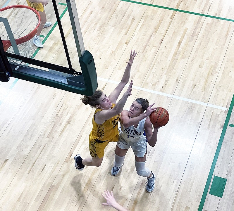 Fatima's Alli Robertson puts up a shot during Tuesday night's Class 4 District 10 Tournament first-round game against Versailles at Blair Oaks High School in Wardsville. (Kyle McAreavy/News Tribune)