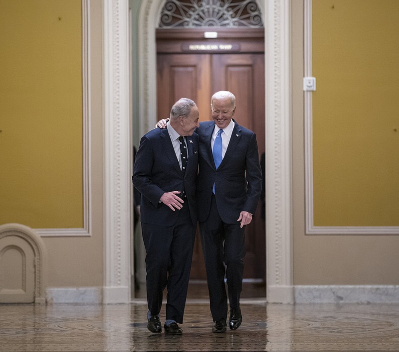 Senate Majority Leader Chuck Schumer (left), D-N.Y., walks with President Joe Biden as they arrive for a lunch with Senate Democrats about his upcoming budget and political agenda, Thursday at the Capitol in Washington.
(AP/J. Scott Applewhite)