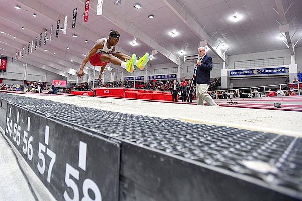 Arkansas jumper Jaydon Hibbert competes during his first-place performance in the triple jump finals, Saturday, Feb. 25, 2023, during the Razorbacks’ championship sweep at the Southeastern Conference 2023 Indoor Track and Field Championships at the Randal Tyson Track Center in Fayetteville.
