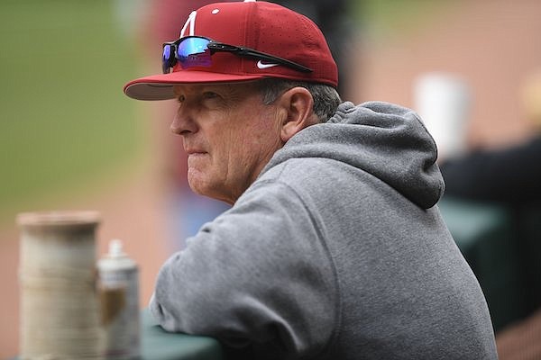 Arkansas coach Dave Van Horn watches Tuesday, Feb. 21, 2023, as his team warms up before the start of the Razorbacks’ 9-7 win over Grambling at Baum-Walker Stadium in Fayetteville.
