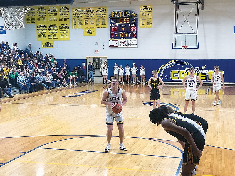 Fatima's Nate Brandt prepares to shoot a free throw during the fourth quarter of Wednesday night's Class 4 District 9 Tournament semifinal game against Fulton in Westphalia. (Tom Rackers/News Tribune)