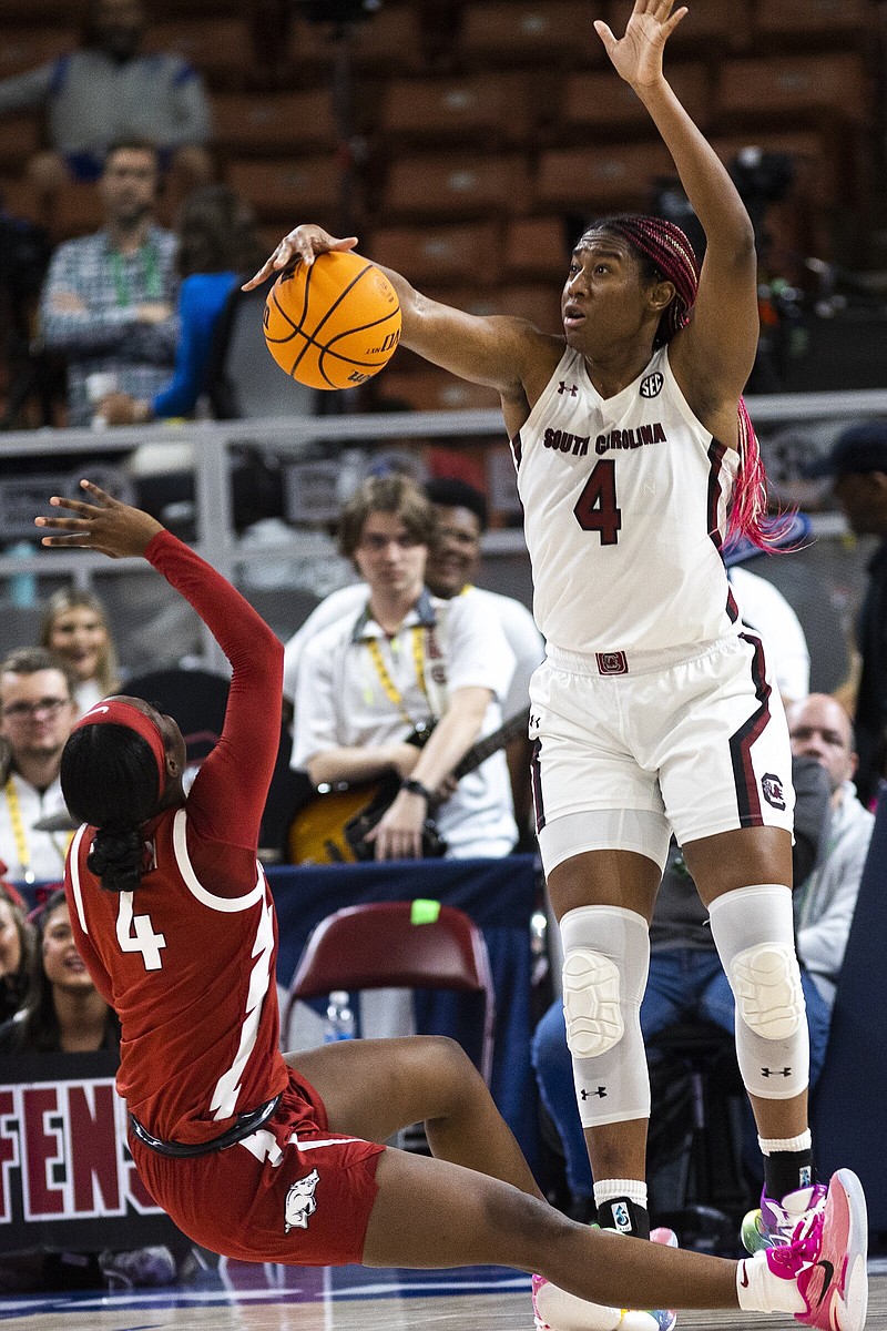 South Carolina’s Aliyah Boston (right) blocks the shot of Arkansas’ Erynn Barnum during the first half Friday in an SEC Tournament quarterfinal at Bon Secours Wellness Arena in Greenville, S.C. The Gamecocks won 93-66 to advance to a semifinal against Ole Miss.
(AP/Mic Smith)