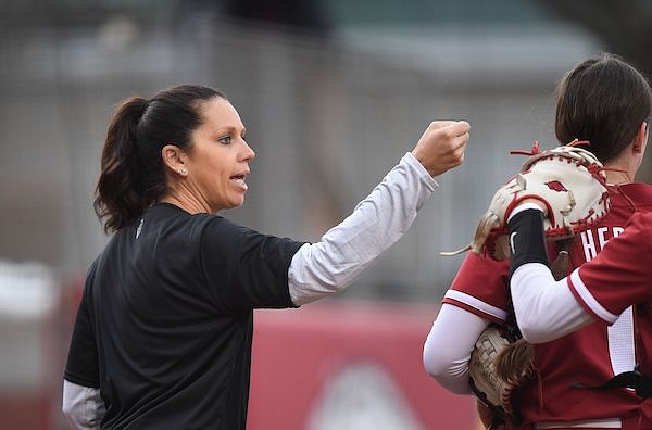 Arkansas coach Courtney Deifel encourages her team Thursday, March 2, 2023, during the Razorbacks’ 4-0 win over Iowa State at Bogle Park in Fayetteville.