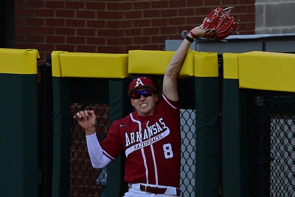 Arkansas right fielder Jace Bohrofen catches a ball at the wall during the second inning of a game against Wright State on Saturday, March 4, 2023, in Fayetteville.