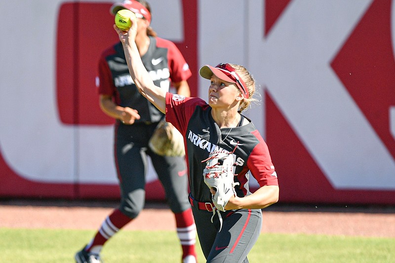 Arkansas right fielder Raigan Kramer (1) throws a ball to second base, Sunday, Oct. 9, 2022, during the second inning of the Razorbacks’ 4-2 win over Louisiana Tech at Bogle Field in Fayetteville.
