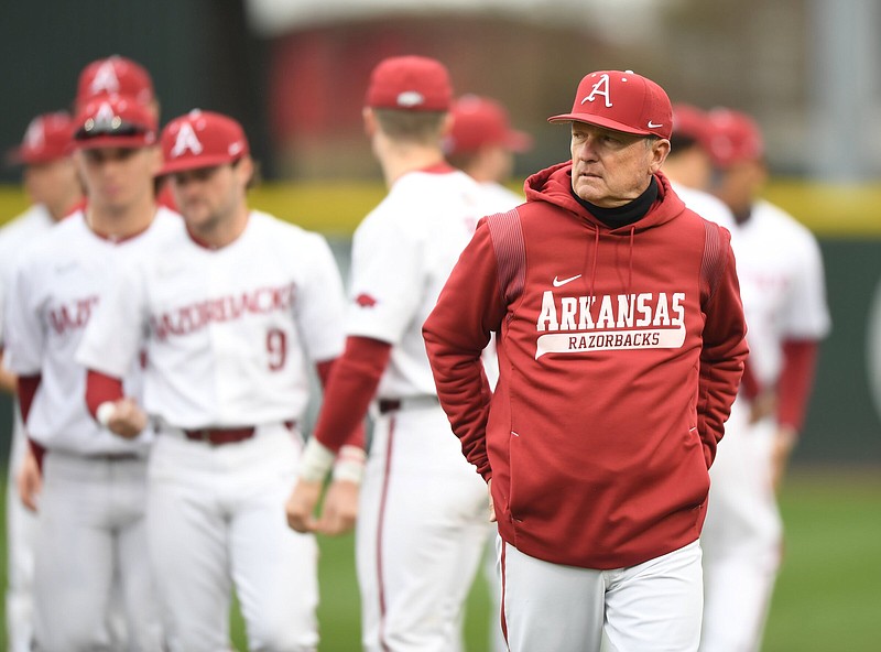 Arkansas coach Dave Van Horn returns to the dugout after speaking to his players Friday, March 3, 2023, before the start of the Razorbacks’ 12-2 run-rule-shortened win over Wright State at Baum-Walker Stadium in Fayetteville..Visit nwaonline.com/photo for today's photo gallery. .(NWA Democrat-Gazette/Andy Shupe)