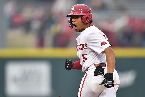 Arkansas designated hitter Kendall Diggs celebrates a home run during the eighth inning of a game against Army on Tuesday, March 7, 2023, in Fayetteville.