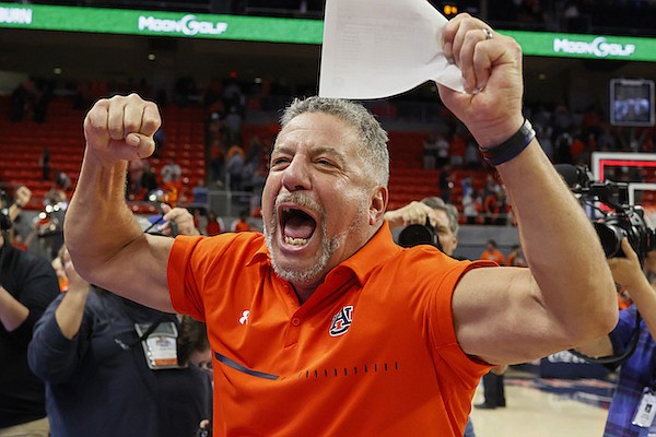 Auburn head coach Bruce Pearl celebrates after Auburn defeated Arkansas during the second half of an NCAA college basketball game Saturday, Jan. 7, 2023, in Auburn, Ala. (AP Photo/Butch Dill) Auburn head coach Bruce Pearl celebrates after Auburn defeated Arkansas during the second half of an NCAA college basketball game Saturday, Jan. 7, 2023, in Auburn, Ala. (AP Photo/Butch Dill)