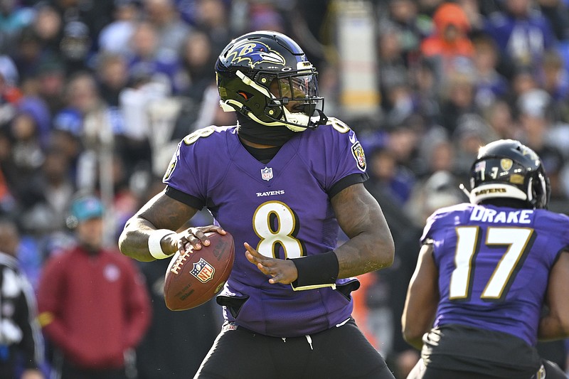 FILE - Baltimore Ravens quarterback Lamar Jackson (8) looks to pass the ball during the first half of an NFL football game against the Denver Broncos, Sunday, Dec. 4, 2022, in Baltimore.