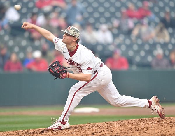 Arkansas reliever Dylan Carter follows through on a pitch Tuesday, March 7, 2023, during the seventh inning of the Razorbacks’ 7-5 win over Army West Point at Baum-Walker Stadium in Fayetteville. Visit nwaonline.com/photo for today's photo gallery. ...(NWA Democrat-Gazette/Andy Shupe)