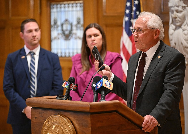 Rep. Jon Eubanks, R-Paris, lifts his phone while talking about legislation regarding social media during a news conference with Gov. Sarah Huckabee Sanders at the state Capitol in Little Rock on Thursday.
(Arkansas Democrat-Gazette/Staci Vandagriff)