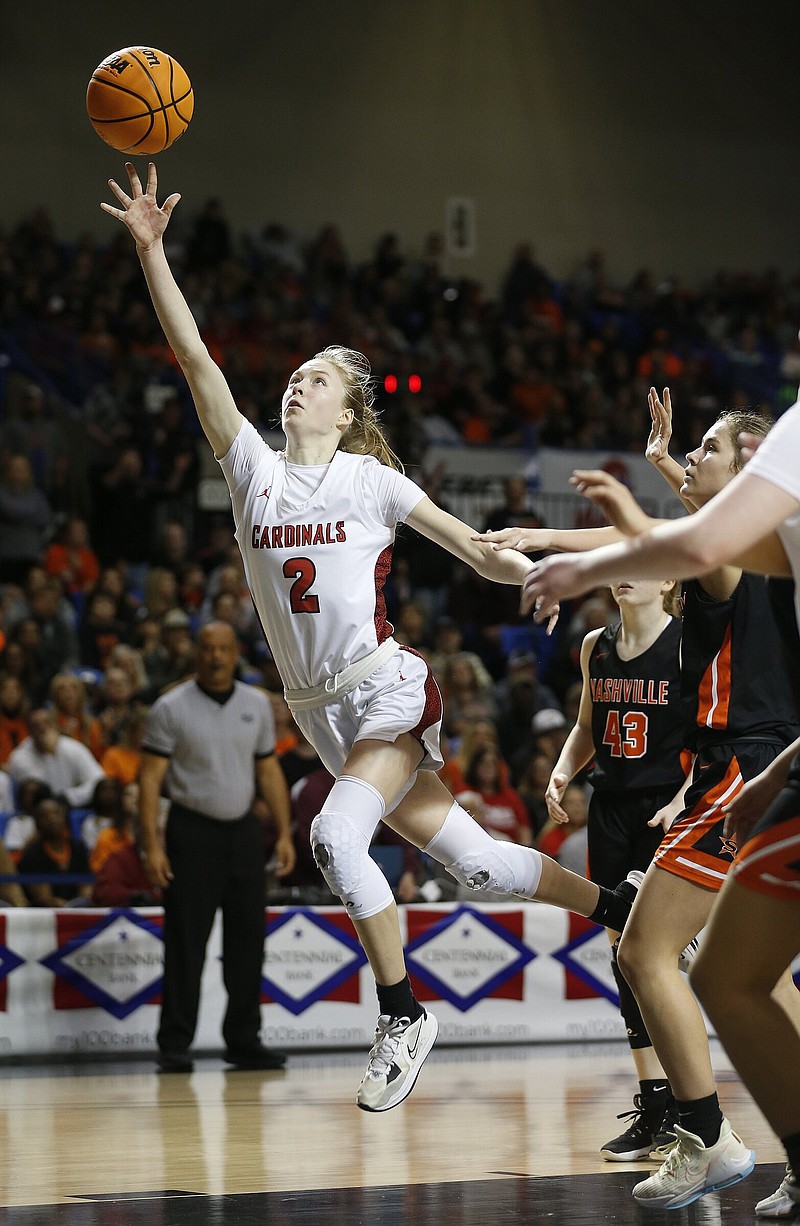 Farmington’s Marin Adams (2) lays in a shot past Nashville defenders during the fourth quarter of the Lady Cardinals’ 65-61 victory in the Class 4A girls state championship game Thursday at Bank OZK Arena in Hot Springs. More photos at www.arkansasonline.com/310girls4a/
(Arkansas Democrat-Gazette/Thomas Metthe)