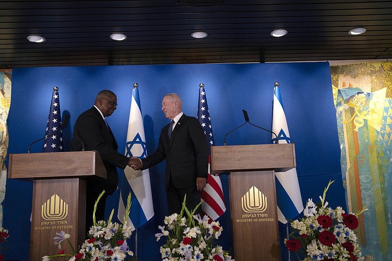 U.S. Secretary of Defense Lloyd Austin (left) shakes hands with his Israeli counterpart, Minister of Defence Yoav Gallant at a joint statement following their meeting Thursday at Ben Gurion International Airport.
(AP/Maya Alleruzzo)