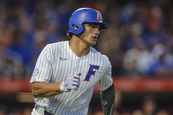 Florida utility Jac Caglianone (14) runs to first base during an NCAA regional championship baseball game against Central Michigan on Friday, June 3, 2022 in Gainesville, Fla. (AP Photo/Gary McCullough)