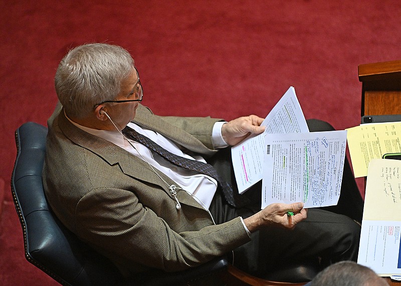 Sen. Dan Sullivan looks over his papers Thursday before presenting the Senate his bill aimed at ending affirmative action in the state. “If we are ever going to stop all discrimination in this state, it will not be by further discrimination,” Sullivan said.
(Arkansas Democrat-Gazette/Staci Vandagriff)