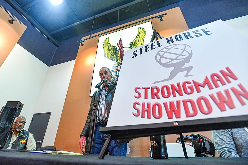 Dennis Snow (center), president and founder of the Steel Horse Rally, speaks, Thursday, March 9, 2023, at a press conference announcing this yearâ€™s charity motorcycle rally at Fort Smith Harley-Davison in Fort Smith. In addition to revealing the May 5-6 event that honors all who serve will for the first time feature a strongman showdown, Snow said charitable donations from it will benefit Antioch for Youth and Family, The Buddy Smith Home for Veterans and The Childrenâ€™s Service League. Visit nwaonline.com/photo for today's photo gallery..(NWA Democrat-Gazette/Hank Layton)