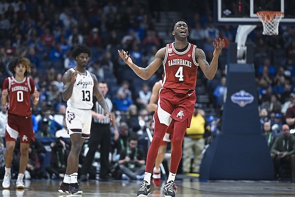 Arkansas guard Davonte Davis (4) reacts on a foul charge, Friday, March 10, 2023 during the second half of the 2023 SEC Men’s Basketball Tournament quarterfinal at Bridgestone Arena in Nashville, Tenn.