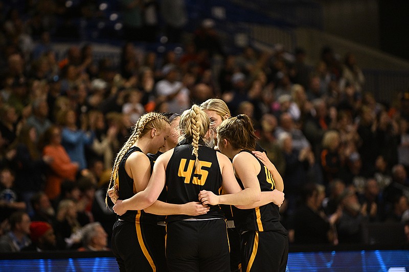 Salem’s starters huddle together before the start of  the Class 3A girls state championship game against Lamar on Saturday at Bank OZK Arena in Hot Springs..(Arkansas Democrat-Gazette/Staci Vandagriff)