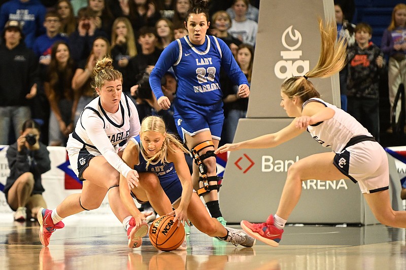 Mt. Vernon-Enola’s Marlee Baby (center) goes after a loose ball as Conway Christian’s Kara Keathley (left) and Brooklyn Pratt try to recover it during the Class 2A girls state championship game Saturday at Bank OZK Arena in Hot Springs. More photos at arkansasonline.com/312girls2abb/.(Arkansas Democrat-Gazette/Staci Vandagriff)