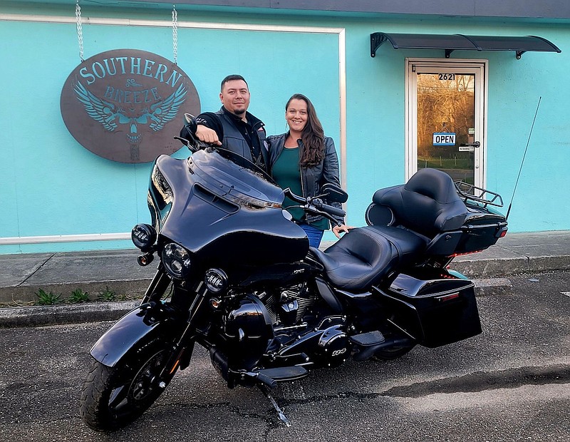 Contributed Photo by Southern Breeze / Andy Lowery and Elysia Bell pose in front of Southern Breeze, a motorcycle shop in Gordon County's city of Fairmount.