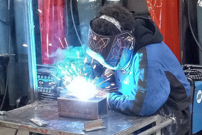 Welding student Sam Black practices his welding on Wednesday inside the welding lab at the new Farmers Bank & Trust Workforce Center on the Texarkana campus of the University of Arkansas Community College at Hope-Texarkana.
(Arkansas Democrat-Gazette/Ryan Anderson)