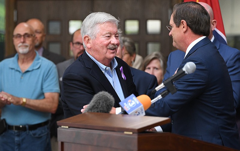 Staff Photo by Robin Rudd / Lt. Gov. Rnady McNally, left, and House Speaker Cameron Sexton shake hands before the bill signing on June 17, 2022.