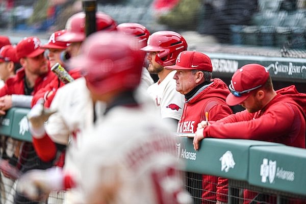 Arkansas head coach Dave Van Horn (center) looks on, Sunday, March 12, 2023, during the first inning between the Razorbacks and the Louisiana Tech Bulldogs at Baum-Walker Stadium in Fayetteville.