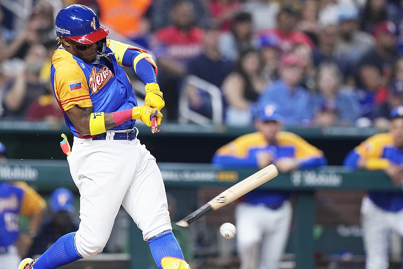 Venezuela's Ronald Acuna Jr. breaks his bat during Saturday night's World Baseball Classic game against the Dominican Republic in Miami. (Associated Press)