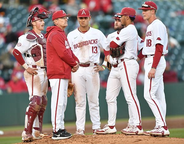 Arkansas coach Dave Van Horn speaks to his infield Tuesday, March 14, 2023, while making a pitching change during the third inning of the Razorbacks’ win over UNLV at Baum-Walker Stadium. Visit nwaonline.com/photo for today's photo gallery. ...(NWA Democrat-Gazette/Andy Shupe)