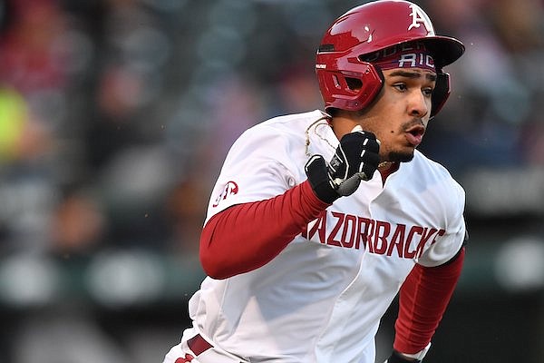 Arkansas second baseman Harold Coll doubles Tuesday, March 14, 2023, during the third inning of the Razorbacks’ win over UNLV at Baum-Walker Stadium in Fayetteville.