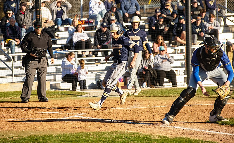 Brock Brenneke of Helias scores a run during Jamboree action Tuesday against Fatima at Vivion Field. (Ken Barnes/News Tribune)