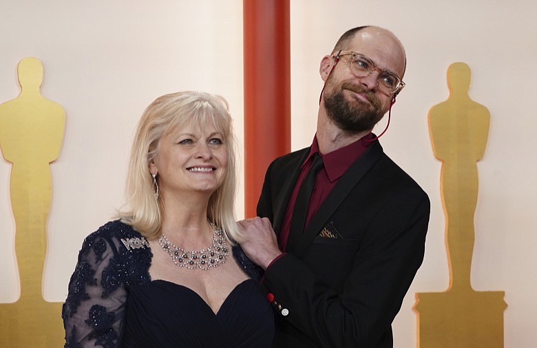 Becky Scheinert, left and Daniel Scheinert arrive at the Oscars on Sunday, March 12, 2023, at the Dolby Theatre in Los Angeles. (Photo by Jordan Strauss/Invision/AP)