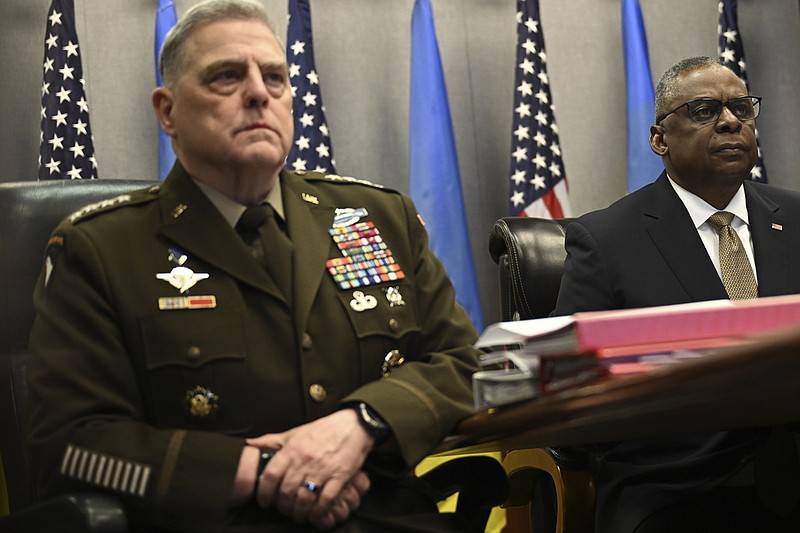 Defense Secretary Lloyd Austin, right, and Chairman of the Joint Chiefs of Staff Gen. Mark Milley, attend a virtual meeting of the Ukraine Defense Contact Group, Wednesday, March 15, 2023, at the Pentagon in Washington. (Andrew Caballero-Reynolds/Pool via AP)