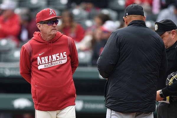 Arkansas coach Dave Van Horn exchanges a lineup card prior to a game against UNLV on Wednesday, March 15, 2023, in Fayetteville.