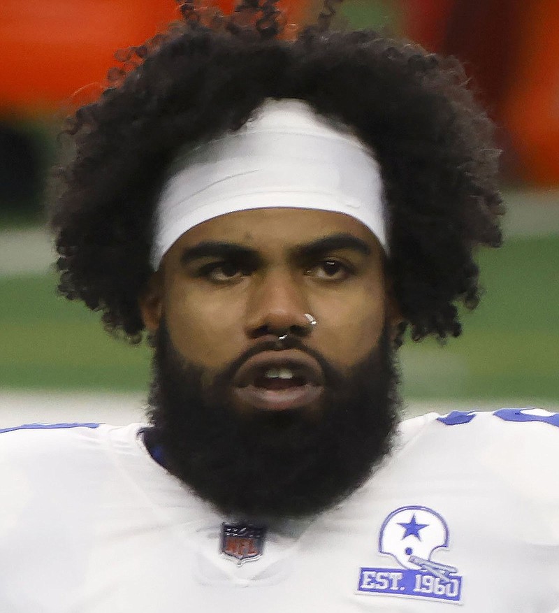 Dallas Cowboys running back Ezekiel Elliott (21) stands on the field for warmups before an NFL football game against the Cleveland Browns in Arlington, Texas, Sunday, Oct. 4, 2020. (AP Photo/Ron Jenkins)