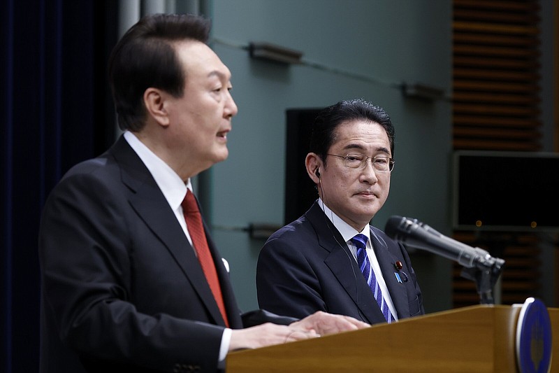Japan’s Prime Minister Fumio Kishida (right) looks on as South Korea’s President Yoon Suk Yeol speaks during a joint news conference Thursday at the prime minister’s official residence in Tokyo.
(AP/Kiyoshi Ota)